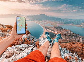 tourist holding a smartphone showing a map